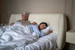© DimaBerlin - Senior man trying to make peace with stressed wife after emotional conflict gently patting on back, family crisis and rejection, elderly lady offended and betrayed by partner, trust loss and apathy