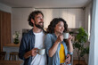 © Migma_Agency - Happy couple enjoying morning coffee in kitchen at home