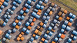 © AmazingAerialAgency - Aerial view of rows of blue and rusty orange steel coils stored at the Tata Steel industrial site Velsen-Noord, Noord-Holland, Netherlands.