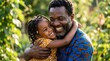 © NE97 - Joyful Black father and young daughter hugging warmly in a sunny garden, celebrating Father's Day, strong family bond, affectionate parenting, outdoor lifestyle portrait.
