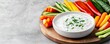 © LIPO@SEXTAO22 - Freshly cut, vibrant vegetable sticks (carrots, bell peppers, cucumber, celery) artfully arranged around a speckled bowl of creamy, herb-topped dip on a wooden platter. Healthy, Snack.