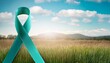 © Abigail - teal ribbon symbolizing sexual assault awareness month in april with nature background