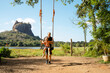 © Gemma can fly/Stocksy - Father and Child Swing in Sigiriya, Sri Lanka. Family travel.