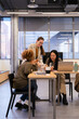 © VICTOR TORRES/Stocksy - Team collaboration in modern office setting
