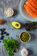 © Helen Rushbrook/Stocksy - Salmon, avocado and other healthy produce.