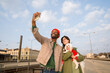 © Hernandez & Sorokina/Stocksy - People Take Selfie With Dog at Train Station