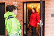 © Diego Martin/Stocksy - Technician Greeting Homeowner at Entrance for Service Appointment