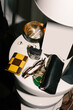 © Adrian Rodd/Stocksy - A close-up shot, lit by direct flash, of a desk with personal items