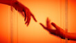 © Marcos Osorio/Stocksy - Hands touch behind frosted glass in warm light