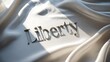 © inkwelldesigns - Liberty script text on elegant white silk fabric