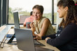 © Guille Faingold/Stocksy - Female Business Team Collaborate in Office