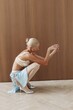© Serge Filimonov/Stocksy - Blonde woman fashion portrait in grace pose