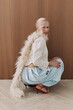 © Serge Filimonov/Stocksy - Trendy fashion portrait of woman in studio