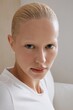 © Serge Filimonov/Stocksy - Natural beauty portrait of blonde woman in white shirt