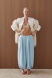© Serge Filimonov/Stocksy - Confident fashion portrait of woman in studio