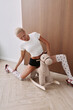 © Serge Filimonov/Stocksy - Woman pose with rocking horse in funny portrait
