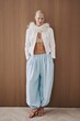 © Serge Filimonov/Stocksy - Full length fashion portrait of woman in studio
