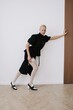 © Serge Filimonov/Stocksy - Studio fashion portrait model in black dress