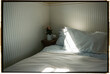 © ByLorena/Stocksy - Morning Light Vacation Bedroom