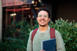 © Dani Nahuel/Stocksy - Latin student man smiling on campus