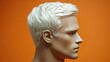 © Boonnam Burart - Profile view of a male mannequin with short platinum blonde hair against a vibrant orange background
