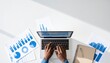 © Robert - Laptop user analyzing charts with business data visualization overlay