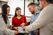 © Ljustina - Business team discussing project plan during office meeting