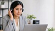© 형근 최 - Generative AI, focused person wearing headphones and looking at laptop screen at work