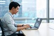 © lan - Man using laptop with AI interface
