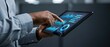 © Pixim Stock - Business professional examining complex financial dashboard metrics using portable digital tablet while working in elegant dark modern corporate office area.