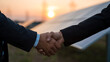 © photo for everything - Professional Business Handshake at Sunset with Clean Energy Technology in Background, Representing Partnership and Sustainable Success