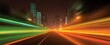 © ckybe - Evening city street with dazzling neon light streaks reflects dynamic urban energy and motion.