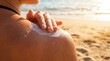 © Aurora Aesthetics - sunscreen applied shoulder beach sun protection summer skin soft sunlit perspective intimate sensory framing hand spreading lotion on glowing shoulder suggests skincare wellness safety body care