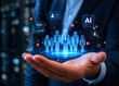 © Denkun - Businessman holding a digital hologram of people and AI icons, representing human resources recruitment, data analytics, and talent management technology concept in a modern corporate office.