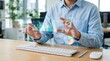© hanif - Man Analyzing Futuristic Holographic Financial Data in Modern Office.