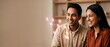 © Fernando - Indian couple analyzing holographic data on a floating augmented reality interface screen in their modern living room, smiling and showing happy collaboration in a warm futuristic smart home concept.