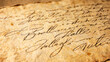 © Sanjit - Elegant cursive handwriting on vintage parchment paper, classic calligraphy letter with ink pen strokes, nostalgic retro correspondence or romantic wedding invitation concept background texture.