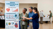 © Xenia - Healthcare professional explaining cardiovascular health infographic to senior couple. Nurse educating elderly patients on heart disease and blood pressure management