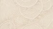 © Moslema - Close-up of beige textured surface with circular patterns