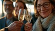 © Marcos Kulenkampff - Friends celebrating with champagne toast at sunset, enjoying a special moment together