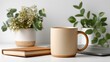 © Asawin - A minimalist workspace with a mug of coffee, a notebook, and two potted plants on a white desk. The scene evokes a sense of calm and productivity