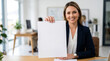 © ViskBx - Professional businesswoman holding a blank white paper for copy space in a modern office environment
