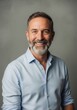 © Ariestia - Confident Smiling Mature Businessman with Grey Beard in Professional Studio Portrait