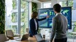 © Emily - Businesswoman presenting global sustainable development metrics and carbon footprint data on large digital screen to colleague in high-tech conference room with vertical garden