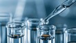 © Pro Hi-Res - Close up shot of laboratory testing water sample with dropper and glass tubes.