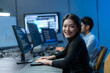 © Jestercine - Smiling Woman Developer Working At Computer In Tech Office