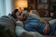 © Vera - Man in His Late Thirties Finds Comfort in Sleep on Cozy Couch at Home After Exhausting Day