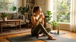 © nilawan - Young woman enjoying a warm beverage in a cozy living room during morning yoga session
