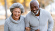 © piai - Cheerful Senior Couple Walking Together Outdoors in Sunny Park, Healthy Active Lifestyle, Retirement Planning and Healthcare Marketing Image