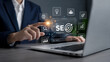 © Rekha - Businessman pointing at virtual seo optimization dashboard on laptop screen for digital marketing strategy.